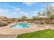 Community pool surrounded by lush landscaping, perfect for enjoying a refreshing swim at 900 W Broadway Ave # 66, Apache Junction, AZ 85120