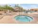 Relaxing community pool area with lounge chairs and shaded umbrellas, offering a resort-style experience at 900 W Broadway Ave # 66, Apache Junction, AZ 85120