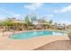 Attractive community pool area with seating, shade, and easy access at 900 W Broadway Ave # 66, Apache Junction, AZ 85120