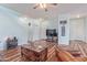 Light-filled living room boasts wood floors, neutral walls, and a staircase to the second floor at 900 W Broadway Ave # 66, Apache Junction, AZ 85120