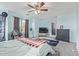 Bright main bedroom with a ceiling fan, gray walls, and neutral carpet at 900 W Broadway Ave # 66, Apache Junction, AZ 85120