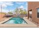 A pool with lounge chairs and jacuzzi at 900 W Broadway Ave # 66, Apache Junction, AZ 85120