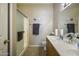 Bright bathroom featuring a double sink vanity and glass-enclosed shower at 9149 E Auburn St, Mesa, AZ 85207