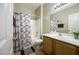 Bathroom featuring a shower and tub combination and a single sink vanity at 9149 E Auburn St, Mesa, AZ 85207