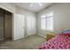 Bedroom with a closet and a window, offering simple comfort at 9149 E Auburn St, Mesa, AZ 85207