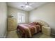 Cozy bedroom with a neutral color scheme, shuttered window and closet space at 9149 E Auburn St, Mesa, AZ 85207