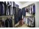 Walk-in closet with clothing racks and shelves to efficiently organize a large wardrobe at 9149 E Auburn St, Mesa, AZ 85207