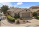 Charming single-story home with well-maintained landscaping, tile roof, and attached garage at 9149 E Auburn St, Mesa, AZ 85207