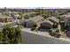 Street view showcases the home's tile roof and desert landscaping providing curb appeal at 9149 E Auburn St, Mesa, AZ 85207