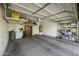 Large garage featuring overhead storage, shelving, and room for vehicle and tools at 9149 E Auburn St, Mesa, AZ 85207