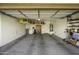 Spacious garage featuring built-in storage shelves and ample space for parking at 9149 E Auburn St, Mesa, AZ 85207