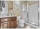 This bathroom features a glass enclosed shower, a dark wood vanity, and natural lighting for a serene bathing experience at 9161 W Bajada Rd, Peoria, AZ 85383