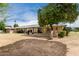 This home features a spacious backyard and covered patio at 9614 W Pleasant Valley Rd, Sun City, AZ 85351