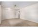 Bedroom showcasing carpeting, a closet, ceiling fan and white walls at 9614 W Pleasant Valley Rd, Sun City, AZ 85351