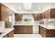 Well-lit kitchen with skylight, tile flooring, and ample counter space at 9614 W Pleasant Valley Rd, Sun City, AZ 85351