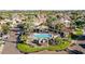 Aerial shot of community pool and water feature amidst lush desert landscaping at 10365 N 101St Pl, Scottsdale, AZ 85258