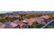 A high-angle view shows a neighborhood with desert landscaping, mountains, and tile roofs at 11416 E Palomino Rd, Scottsdale, AZ 85259