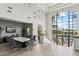 Lobby featuring tile floors, a conference table, and a view of the pool from large windows at 11416 E Palomino Rd, Scottsdale, AZ 85259