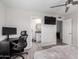 Neutral bedroom featuring a desk area and an en-suite bathroom at 11612 S 51St St, Phoenix, AZ 85044