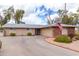 Spacious single-story home with a long driveway and well-maintained desert landscaping at 11612 S 51St St, Phoenix, AZ 85044