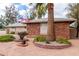 Single-story home with desert landscaping and a tall palm tree at 11612 S 51St St, Phoenix, AZ 85044