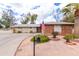 Charming single-story home with an American flag, desert landscaping, and a curved driveway at 11612 S 51St St, Phoenix, AZ 85044