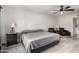 Comfortable bedroom featuring a ceiling fan, side tables, and carpeted floor at 11612 S 51St St, Phoenix, AZ 85044