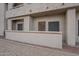 Exterior view of the home, showing the gravel and exterior entrance at 11666 N 28Th Dr # 196, Phoenix, AZ 85029