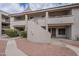 Multi-level apartment complex featuring red rock landscaping and a textured facade at 11666 N 28Th Dr # 196, Phoenix, AZ 85029
