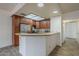 Kitchen featuring wooden cabinetry, granite countertops, and stainless steel refrigerator at 11666 N 28Th Dr # 196, Phoenix, AZ 85029