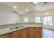 Kitchen with granite breakfast bar overlooking dining and living areas at 11666 N 28Th Dr # 196, Phoenix, AZ 85029