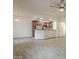 Open floor plan showcasing kitchen with breakfast bar and stainless steel appliances at 11666 N 28Th Dr # 196, Phoenix, AZ 85029