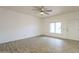 Bright, open living room with wood-look flooring, neutral paint, and natural light at 11666 N 28Th Dr # 196, Phoenix, AZ 85029