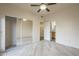 Bedroom with wood-look floors, mirrored closet, and ensuite bathroom at 11666 N 28Th Dr # 196, Phoenix, AZ 85029