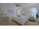 Serene main bedroom with a plush bed, elegant nightstands, and ample natural light from windows at 13229 W Marble Dr, Sun City West, AZ 85375