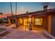 Back patio featuring a tiled outdoor area with a dining set, perfect for enjoying scenic views at 15751 W Linksview Dr, Surprise, AZ 85374