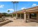 Expansive back patio with tiled area, water feature, and desert landscaping, perfect for relaxation at 15751 W Linksview Dr, Surprise, AZ 85374