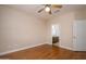 Bedroom with hardwood floors and ceiling fan provides a tranquil space for relaxation at 15751 W Linksview Dr, Surprise, AZ 85374