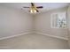 Neutral bedroom with carpet and window at 15751 W Linksview Dr, Surprise, AZ 85374
