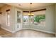 Bright dining room with backyard views and an entry/exit door at 15751 W Linksview Dr, Surprise, AZ 85374