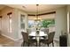 Bright dining room with backyard views and a stylish light fixture at 15751 W Linksview Dr, Surprise, AZ 85374
