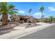 Beautiful home featuring manicured front yard, desert landscaping, and a circular driveway at 15751 W Linksview Dr, Surprise, AZ 85374