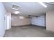 Spacious garage with abundant built-in cabinet space and overhead lighting perfect for storage and projects at 15751 W Linksview Dr, Surprise, AZ 85374