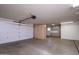 Spacious garage with ample storage cabinets offers organization and convenience for vehicles and tools at 15751 W Linksview Dr, Surprise, AZ 85374