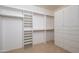 Spacious walk-in closet with ample shelving and storage options provides tons of room for organization at 15751 W Linksview Dr, Surprise, AZ 85374
