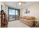 Comfortable bedroom with a sliding glass door leading to a private balcony with city views at 16 W Encanto Blvd # 616, Phoenix, AZ 85003