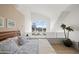 Comfortable bedroom features a large window showcasing vibrant city views and neutral decor at 16 W Encanto Blvd # 616, Phoenix, AZ 85003
