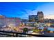 Balcony view overlooking the city skyline with parking and bright city lights at dusk at 16 W Encanto Blvd # 616, Phoenix, AZ 85003