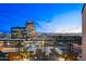Balcony view overlooking the city skyline with distant mountains and bright city lights at dusk at 16 W Encanto Blvd # 616, Phoenix, AZ 85003