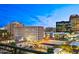 Balcony view overlooking the city skyline with parking and bright city lights at dusk at 16 W Encanto Blvd # 616, Phoenix, AZ 85003